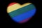 Heart shape on the LGBT rainbow flag. Symbol of love and freedom. Black background. The concept of tolerance and independence of