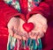 Heart shape love symbol in woman hands Valentines Day