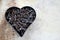 Heart shape with rusted nails and rustic background