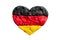Heart shape of tricolour German flag plasticine modeling clay isolated on white background. Black, red and yellow flag of Germany