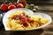 Heart-shaped bowl of spaghetti Bolognaise