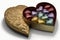 heart-shaped box of assorted chocolates or truffles with foil or cellophane wrapping