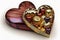 heart-shaped box of assorted chocolates or truffles with foil or cellophane wrapping