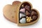 heart-shaped box of assorted truffles or chocolates in clear packaging