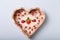 Heart shaped box with small wooden decorative pins with tiny red ladybugs for handwork, handmade decorations, leisure time