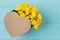 Heart shaped box and yellow jerusalem artichoke flowers.