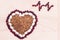 Heart-shaped buckwheat with beans on wooden background