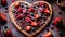 a heart shaped chocolate pizza with strawberries and blueberries