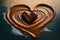 heart-shaped churro floating in pool of warm chocolate sauce