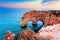 Heart-shaped cliffs on the shore of Atlantic ocean in Algarve, Portugal