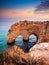 Heart-shaped cliffs on the shore of Atlantic ocean in Portugal