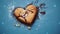 Heart shaped cookie with chocolate on blue background