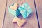 Heart shaped cookies in a blue gift box on a wooden background