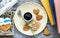 Heart shaped cookies, coffee, lavender, shell and books  are nearby on wooden table