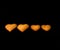 Heart-shaped cookies in descending order isolated on a black background