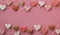 Heart-Shaped Cookies on a Pink Fabric Sweater. A love decoration. Valentine's Day background. View from the top