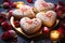 Heart-shaped cream cakes for valentine\\\'s day on a festive table with candles and flowers