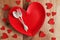 Heart Shaped Dinner Plate with Fine Silverware on Wood Plank Tab