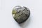 Heart shaped dragon\\\'s blood jasper polished gemstone on a white background