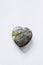 Heart shaped dragon\\\'s blood jasper polished gemstone on a white background