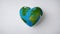 heart shaped earth A heart-shaped earth on a white background. The earth is green and blue and has some land and water