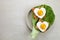Heart shaped egg in tosted slice of rye bread ceramic plate. Love breakfast design. Healthy sandwich. Festive lunch or