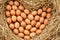 Heart-shaped eggs placed on straw