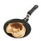 Heart shaped flapjack pancake in a pan