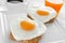 Heart-shaped fried eggs, bread and orange juice
