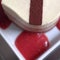 Heart shaped frozen cake with raspberries sauce