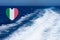 Heart shaped italian flag on background made of view of deep blue Mediterranian sea