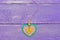 Heart shaped jewelry for Valentine`s Day. Valentines day felt heart jewelry on the purple wooden background. Cute gift