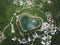 Heart shaped love lake shot. Aerial drone view of peace symbol in natural environment. Overhead natural wonder pond