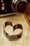 Heart shaped made from retro film negative on wooden board with bokeh from vintage camera