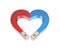 Heart shaped magnet. Concept Love attracts. Blue-red heart.