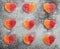 Heart shaped marmalade sweets on gray stone background