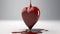 a heart shaped object with blood flowing out of it\\\'s sides and a drop of blood coming out of it\\\'s sides