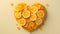 Heart shaped orange slices, Fruity love motif made of orange, isolated on pastel background.