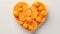 Heart shaped orange slices, Fruity love motif made of orange, isolated on pastel background.