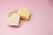 Heart shaped pink bar of soap on a light pink background. Top view, copy space. Heart shaped soaps. Importance of