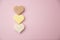 Heart shaped pink bar of soap on a light pink background. Top view, copy space. Heart shaped soaps. Importance of