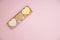 Heart shaped pink bar of soap on a light pink background. Top view, copy space. Heart shaped soaps. Importance of