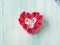 Heart shaped pink red roses on pastel color