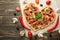 Heart-shaped pizza, Valentine`s Day. With vegetables. A concept of tasty and healthy food with love. Free-lay
