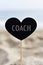 Heart-shaped signboard with text coach