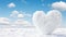 Heart shaped snow cloud in clear cold sky, winter weather scenery with romantic atmosphere