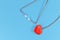 Heart shaped stethoscope on blue background