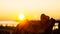 Heart shaped stone liyng treetrunk with sunset and as background