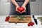 a heart-shaped tomato. a woman`s hands hold a heart-shaped tomato