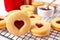 Heart shaped traditional linzer cookies with strawberry jam. Valentine s day concept.